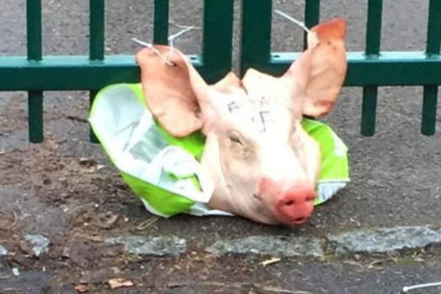 A pig's head left tied to the Madani school gate in Portsmouth