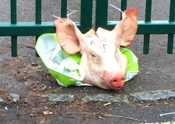 A pig's head left tied to the Madani school gate in Portsmouth