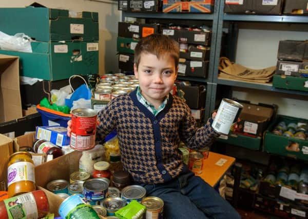 Ronnie Hazlie, eight, has collected more than a 1,000 and tins of food and donated them to Gosport Basics Bank.

Picture: Allan Hutchings (160144-275)