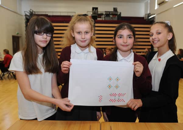 From left, Izzy Doyle, Grace Dixon, Caitlin Bitri and Hatty Robbins from Meon Junior School at the Maths Challenge. 

Picture: Sarah Standing (160517-7487)