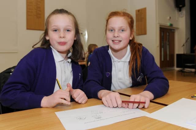 Katelyn Ingram, left, and Paige Ruffell from Wimborne Junior School 

Picture: Sarah Standing (160517-7507)