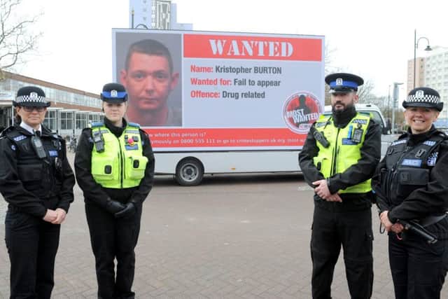 Crimestoppers' vans went to Gosport and Havant yesterday. From left, temporary chief inspector Clare Jenkins, PCSO Emmer Riley, PCSO Jamie Lewis and Sgt Tracy Scrase Picture: Sarah Standing (160538-9404)
