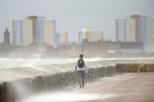 Strong winds and heavy rain pound Clarence Esplanade, Southsea Picture: Allan Hutchings (160427-766)