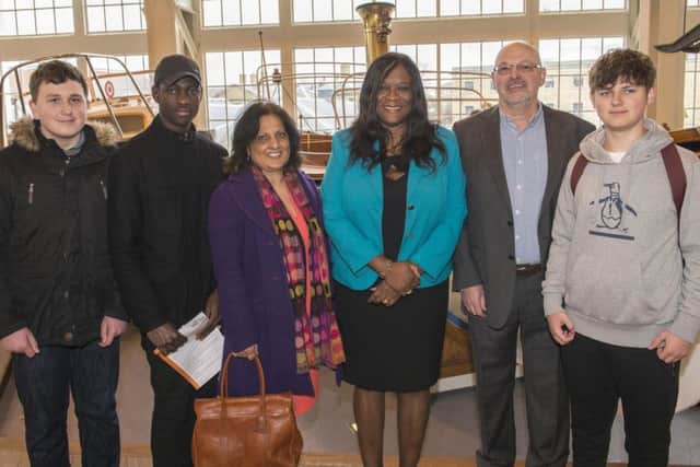 Future students Nathan George, 16, from Cosham, Sarjo Sanyang, 18, from Southsea, with Satwant Deol, from Highbury College, principal Stella Mbubaegbu, business development manager Don Lang, and another future student Owen Bonney, 16, from Waterlooville, in Boathouse 4, at Portsmouth Historic Dockyard, where the new Solent Marine Academy is going to open in September
Picture: Steven Springer