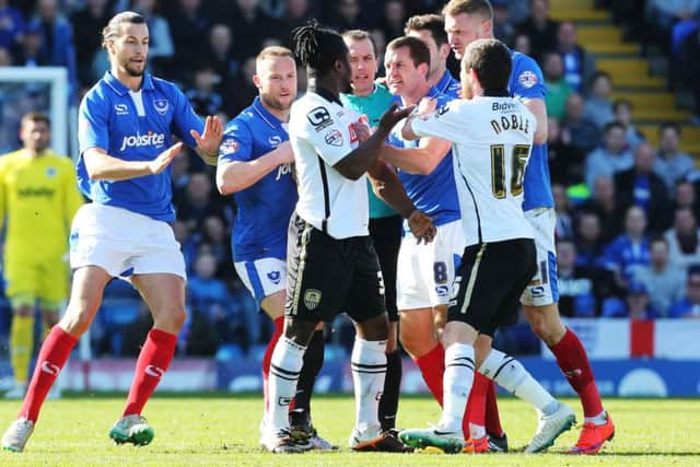 Pompey skipper Michael Doyle tussles with Notts Countys Stanley Aborah during the Good Friday win over the Magpies