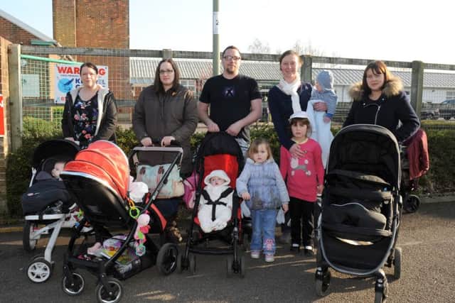 Parents from Gosport and Fareham, from left, Gemma Blanks, 32, Kirsty Wilson, 32, Adam Darby, 31, Rosalyn Fawcett, 33 and Leanda Woodward, 32, with their children outside The Haven Sure Start centre in Gosport Picture: Sarah Standing (160513-7191)