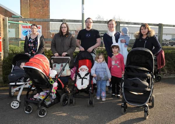 Parents from Gosport and Fareham, from left, Gemma Blanks, 32, Kirsty Wilson, 32, Adam Darby, 31, Rosalyn Fawcett, 33 and Leanda Woodward, 32, with their children outside The Haven Sure Start centre in Gosport Picture: Sarah Standing (160513-7191)