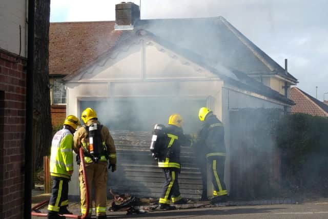 Firefighters tackle the blaze at the garage in Highlands Road, Fareham, on Sunday Picture: Darren Ford
