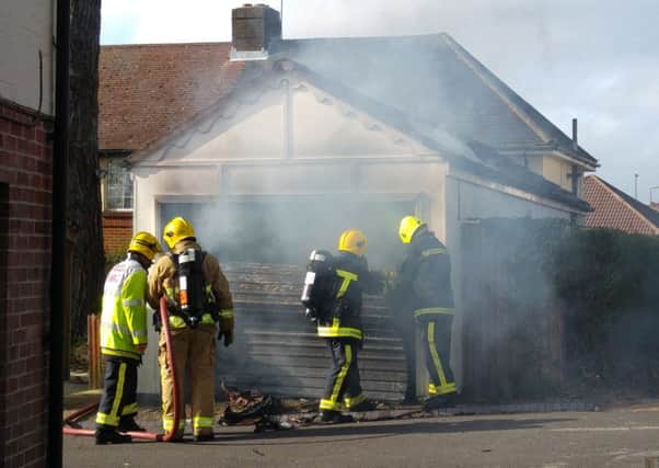 Firefighters tackle the blaze at the garage in Highlands Road, Fareham, on Sunday 
Picture: Darren Ford