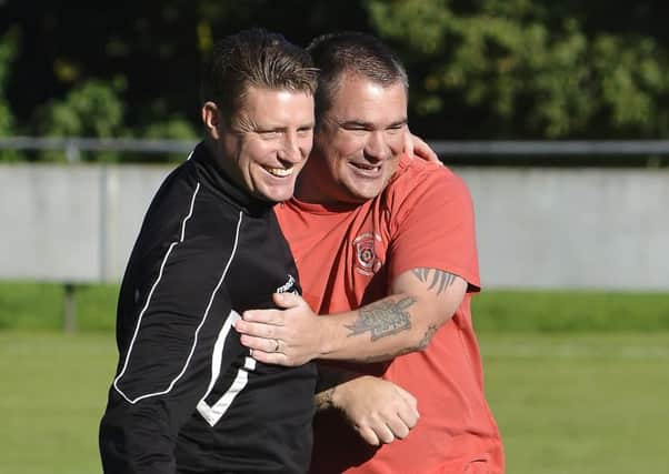 Petersfield Town boss Ian Saunders, right     Picture: Neil Marshall