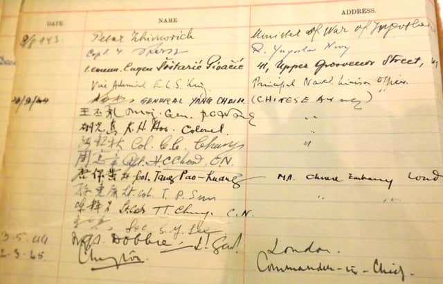 A page from the wardroom guest book with signatures of the Chinese Army personnel.