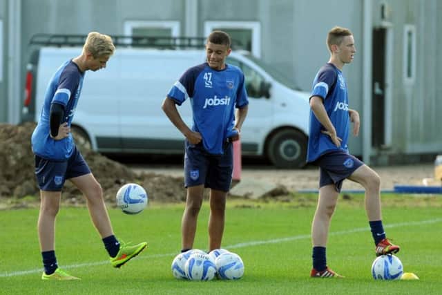 Pompey Academy trio Alex Bass, Christian Oxlade-Chamberlain and Adam May in training   Picture: Paul Jacobs