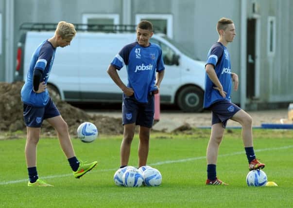 Pompey Academy trio Alex Bass, Christian Oxlade-Chamberlain and Adam May in training   Picture: Paul Jacobs