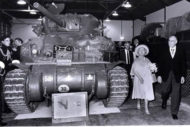 The Queen Mother beside a Sherman tank after she opened the D-Day Museum in  1984
