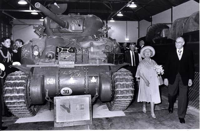 The Queen Mother beside a Sherman tank after she opened the D-Day Museum in  1984