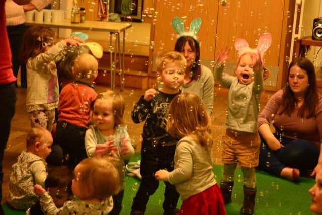 GOOD TIMES Children enjoy a Melody Tots Easter party