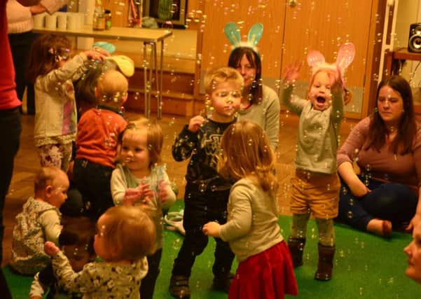 GOOD TIMES Children enjoy a Melody Tots Easter party