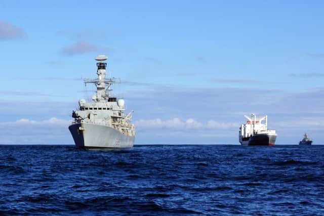 Ministry of Defence handout photo of HMS Somerset (left) shadowing a Russian naval task group as it travelled through the English Channel and along the east coast of the UK. Picture: ET Ryan Curtis/MoD/Crown Copyright/PA Wire