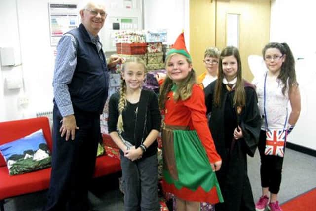 AID Rotary Club of Fareham Meon President, Tony Billings, collecting shoe boxes from The Crofton Hammond Junior School in Stubbington