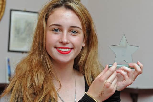 14/06/14  JTYoung people from across the Portsmouth area attend The News Youth Awards which was held at the Kings Theatre in Southsea. Chloe Hine wins The Music Star award.Picture: Ian Hargreaves  (150970a-16) PPP-150615-162657006