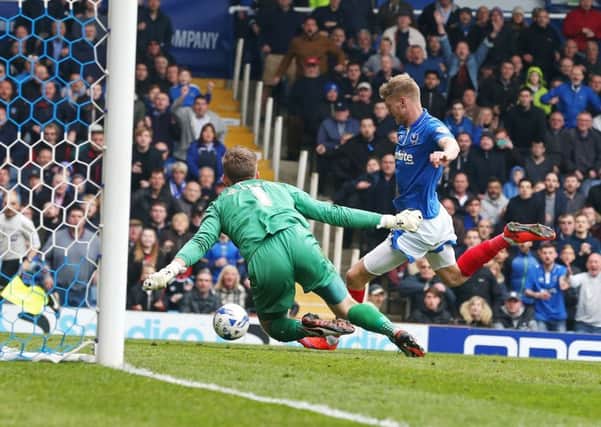 Michael Smith opens the scoring for Pompey Picture: Joe Pepler