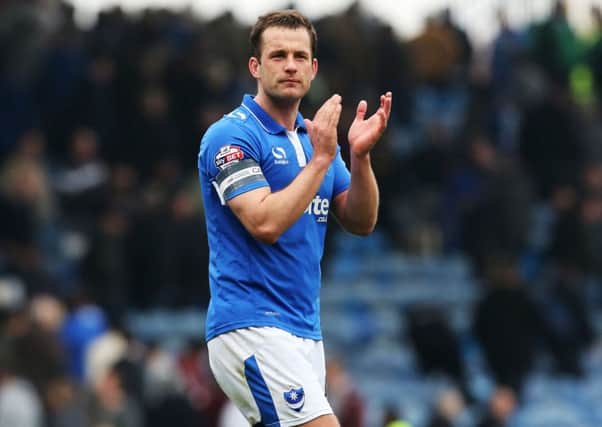Pompey skipper Michael Doyle applauds the fans at the final whistle Picture: Joe Pepler