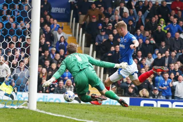 Michael Smith scores Pompey's winning goal against Carlisle Picture: Joe Pepler