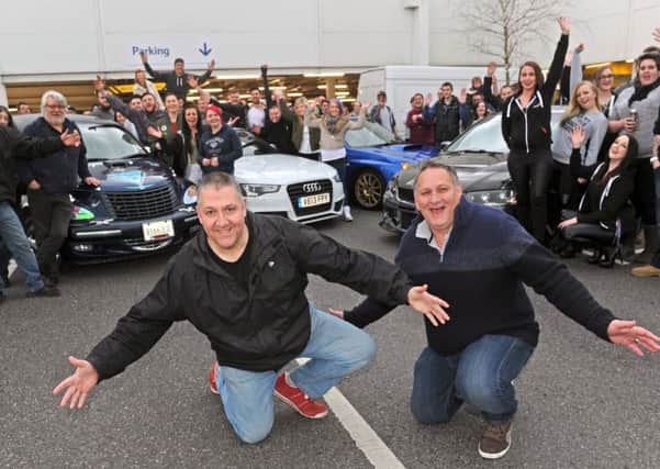 Taff Evans, left, and Kevin Thorpe with members of car clubs who got together to raise money for Lola-Mai Burns from Havant, after the event was moved from Tesco in Portsmouth at the last minute  Picture: Ian Hargreaves (160571-03)