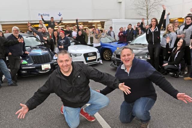 Taff Evans, left, and Kevin Thorpe with members of car clubs who got together to raise money for Lola-Mai Burns from Havant, after the event was moved from Tesco in Portsmouth at the last minute Picture: Ian Hargreaves (160571-03)
