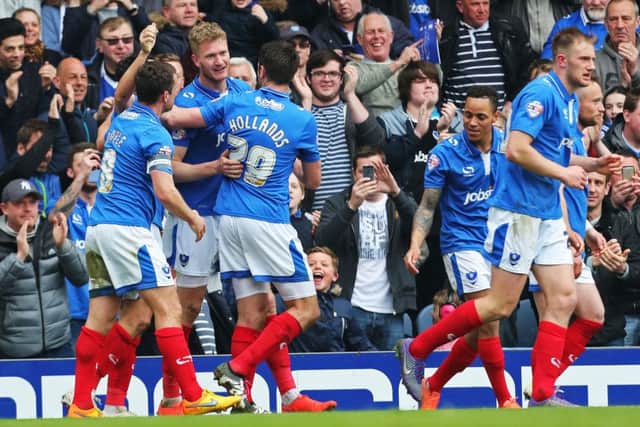 Michael Smith, centre, is congratulated by his team-mates after his match-winner againsy Carlisle on Saturday  Picture: Joe Pepler