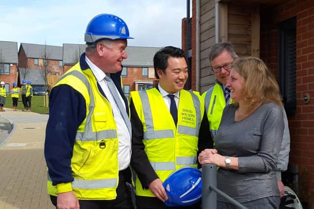 Alan Mak MP with new homeowner Tracie Billingham at the One Eight Zero development in Bedhampton, Havant, with representatives from NHBC and David Wilson Homes