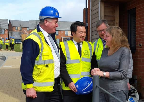 Alan Mak MP with new homeowner Tracie Billingham at the One Eight Zero development in Bedhampton, Havant, with representatives from NHBC and David Wilson Homes