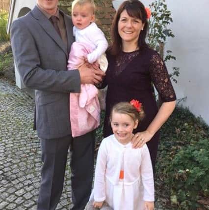Carly Mackie with her husband Dean and their children