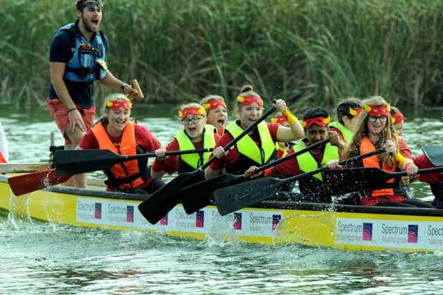CHARITY FUN Participants in the dragon boat festival