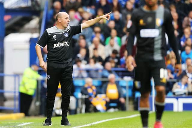 Paul Cook keeps an eye on his players during the Mansfield match. Picture: Joe Pepler