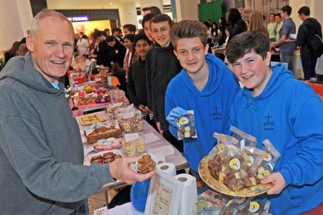 Mick Mellows of Faith + Football, with Oaklands Catholic School pupils Richard Pass-Alano and Diardaid Ward-Farrell                                                                              Picture: Ian Hargreaves  (160346-1)