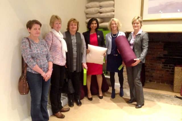 WINDFALL Fareham MP Suella Fernandes, centre, on her visit to The Haven in Titchfield