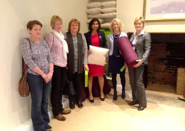 WINDFALL Fareham MP Suella Fernandes, centre, on her visit to The Haven in Titchfield