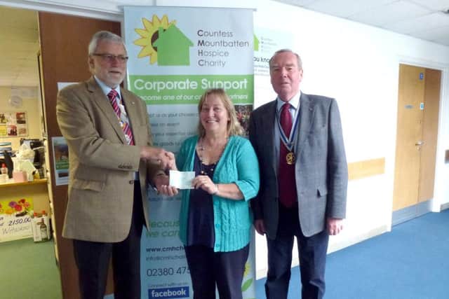Gosport Rotary president Ken Eckersley and Rotary secretary Graham Collins present a cheque to Mandy Baker at Countess Mountbatten