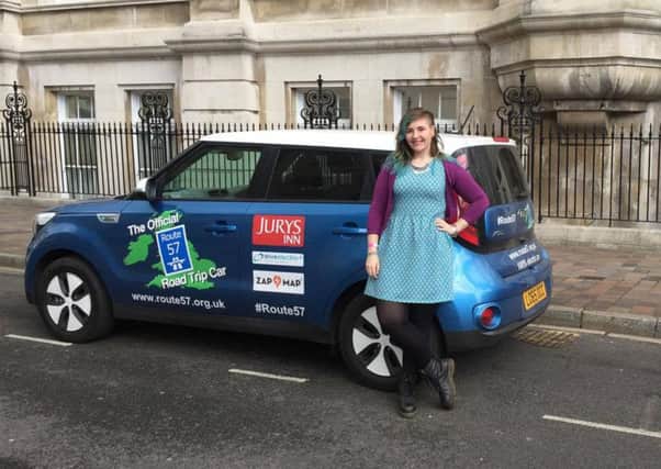 Jess Shanahan with the Route 57 car outside Portsmouth Guildhall