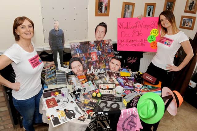 Vicky Hall, 29, and her mum Karen Hall, 54, from Gosport, with just some of their Take That merchandise.  Picture: Sarah Standing (160604-1262)