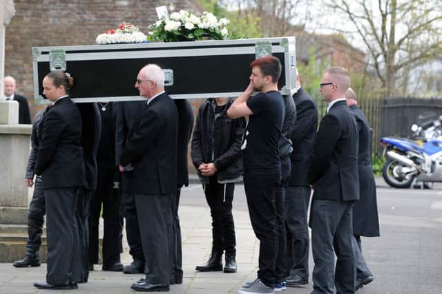 The coffin is carried into Holy Trinity Church in Gosport