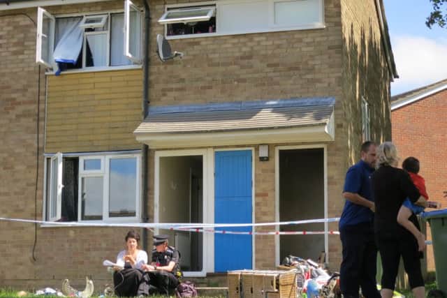 Coral Gray being treated for smoke inhalation after the blaze