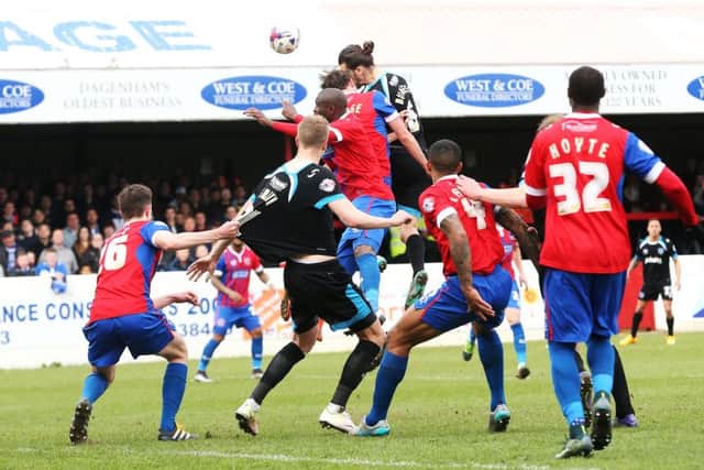 Christian Burgess heads Pompey in front Picture: Joe Pepler