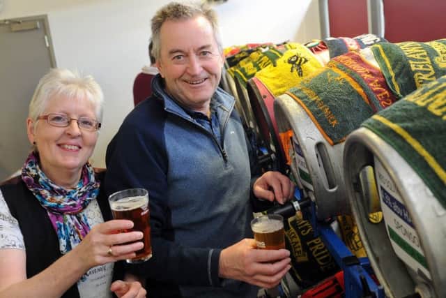 Pulling the pints are Linda Bentley and Terry Chapman.