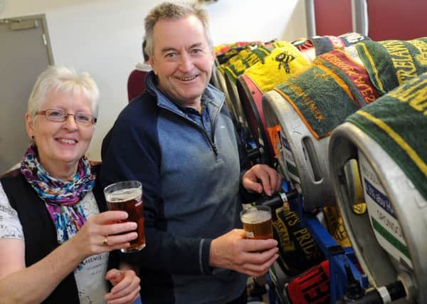 Pulling the pints are Linda Bentley and Terry Chapman.