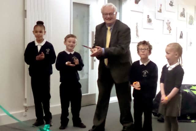 Cllr Peter Edgar officially opens the new facilities with pupils from Riders infant and junior schools