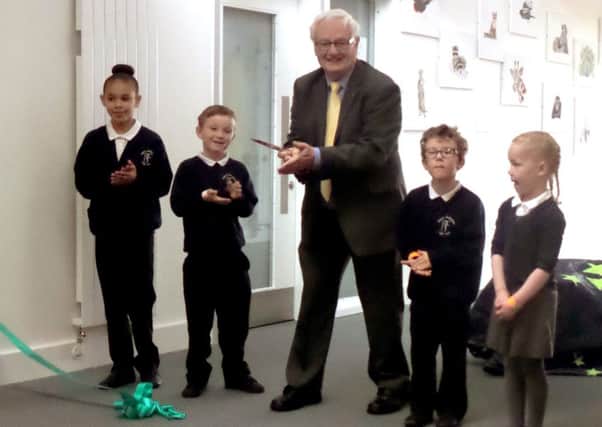 Cllr Peter Edgar officially opens the new facilities with pupils from Riders infant and junior schools