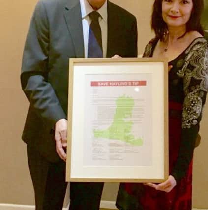 The open letter protesting about the proposed closure of the tip on Hayling Island was handed to the leader of Hampshire County Council, Roy Perry by resident and campaigner Alli Wiltshire