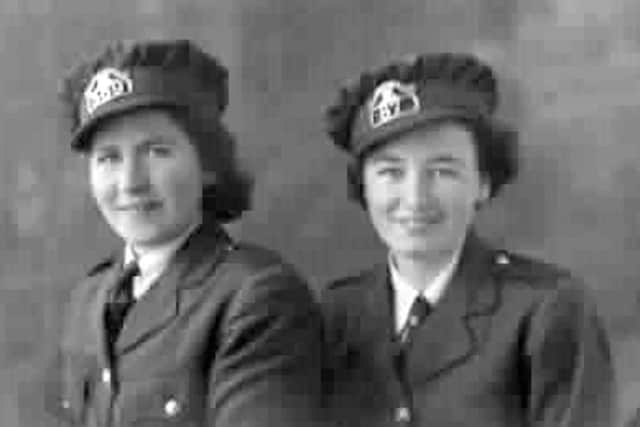 Mary Mathews and Peggy Edwards in their clippie uniforms.